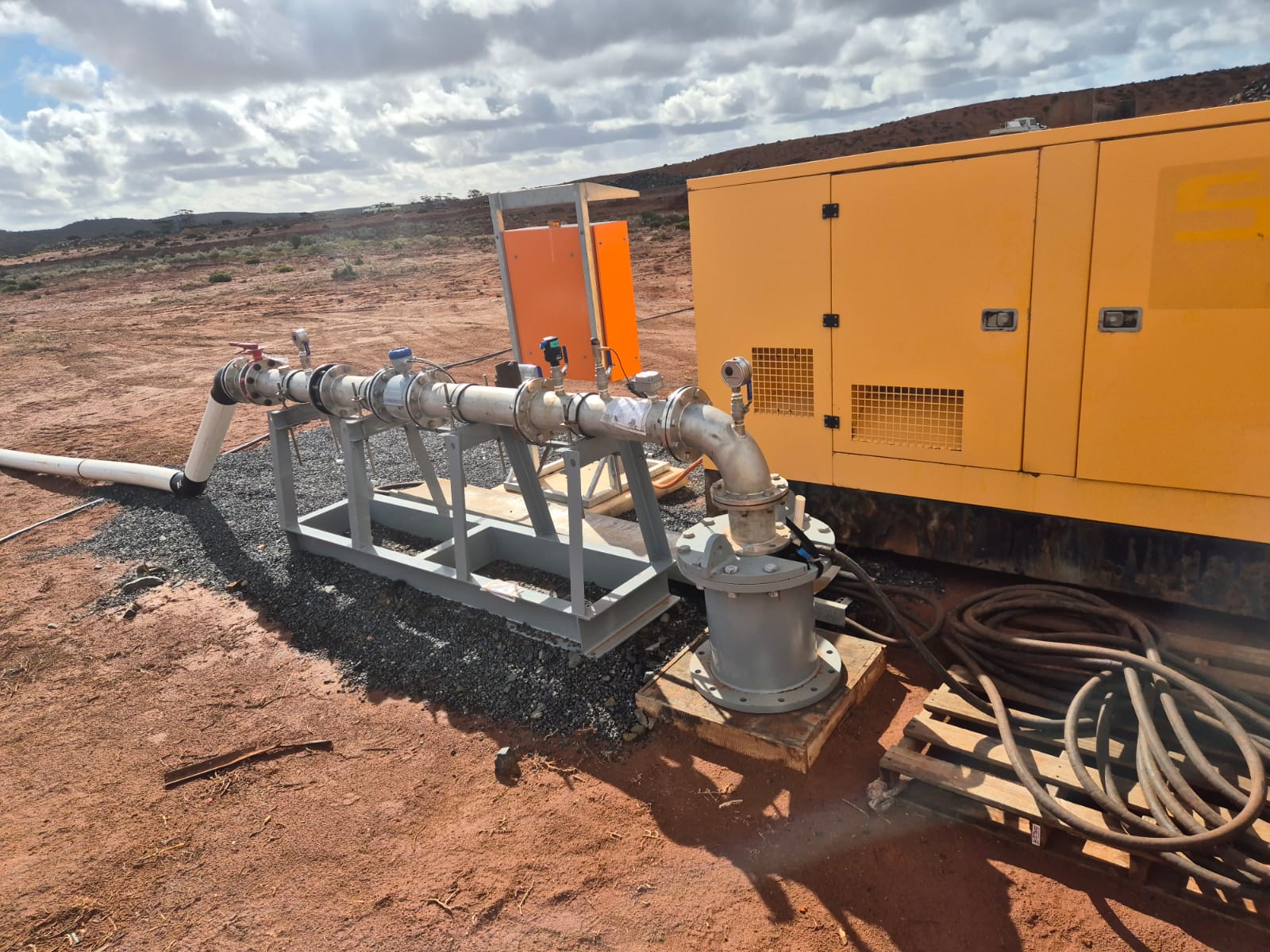 Dewatering pump set and generator beside water on a civil site