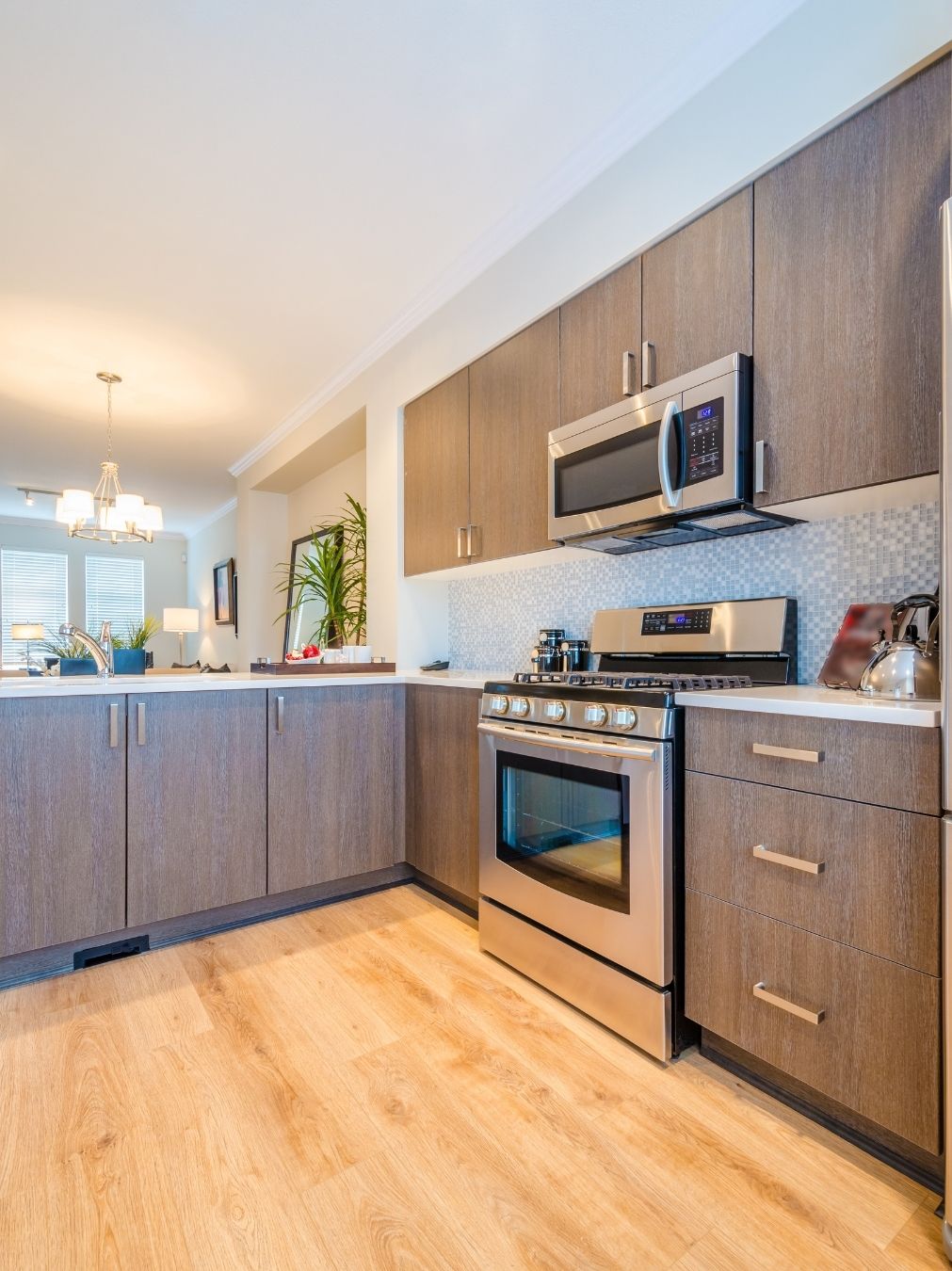 Kitchen cooking zone with island and feature lighting