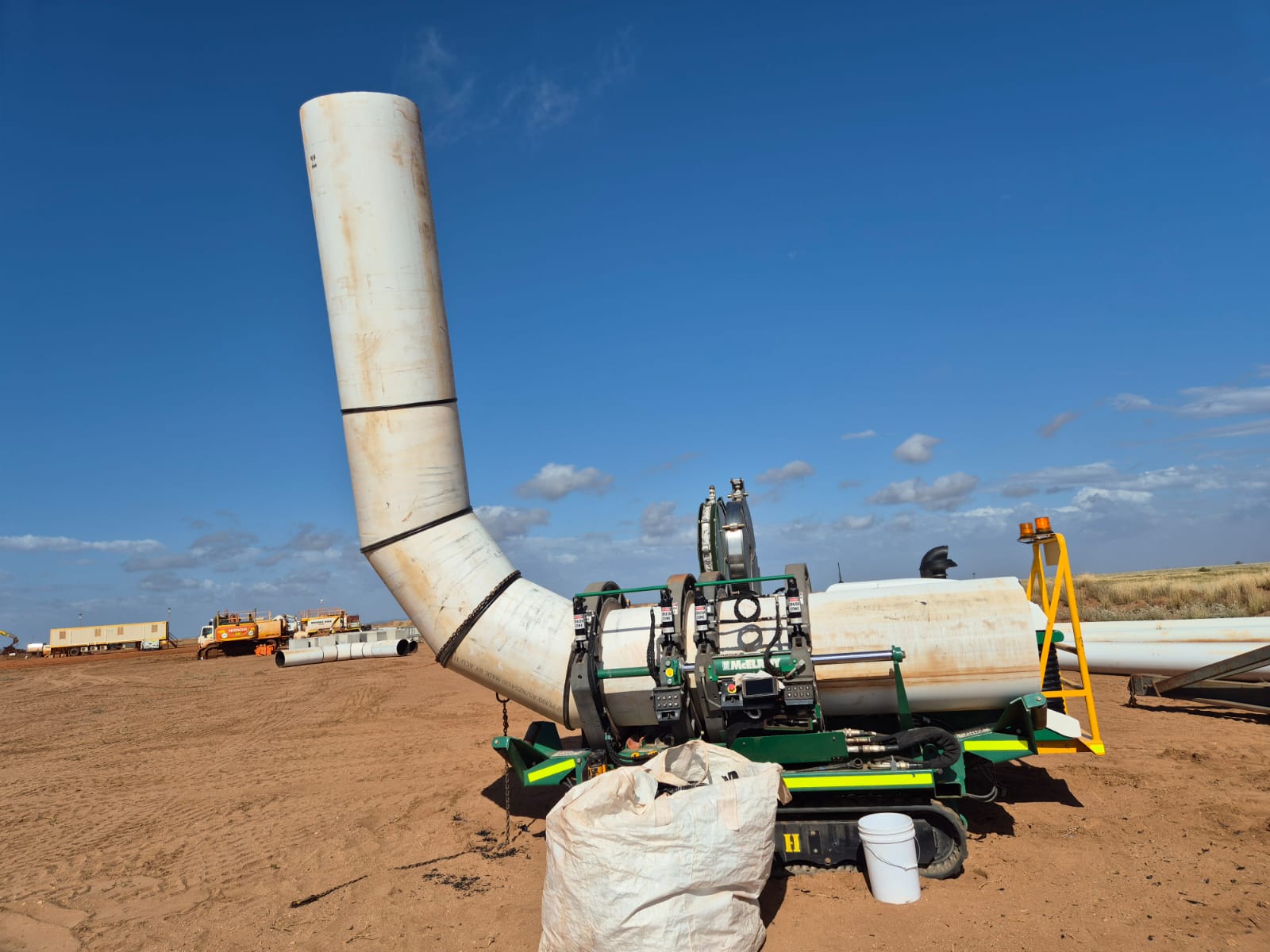 Fusion machine positioned on a large-diameter HDPE pipeline
